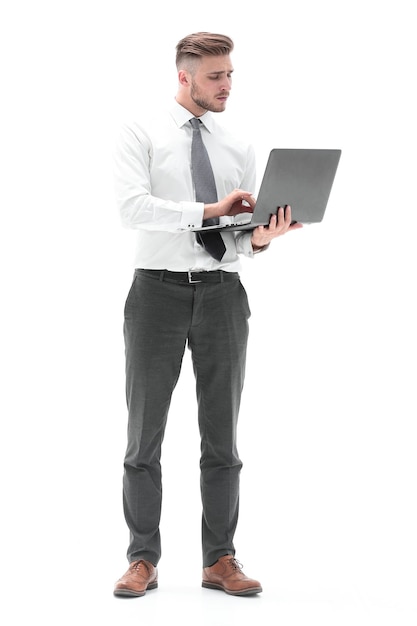 In full growth businessman using laptop