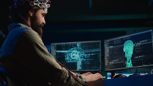 IT admin coding and using EEG headset to upload brain into computer