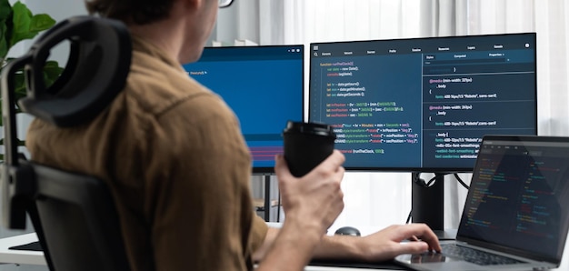 it developer drinking coffee while working in creating program codding gusher