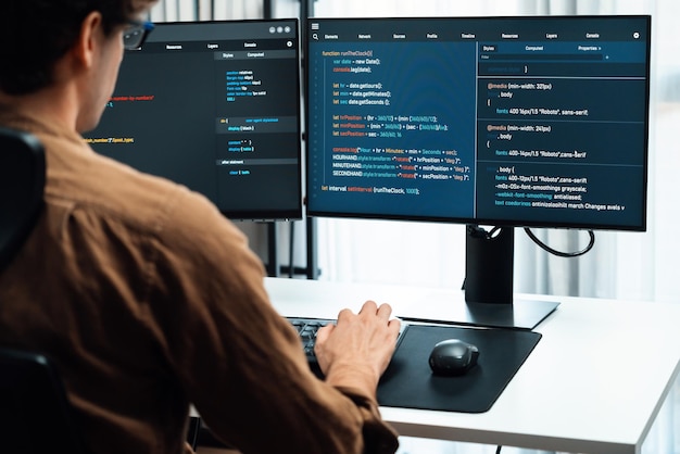 It developer working online software development coding on pc screens gusher