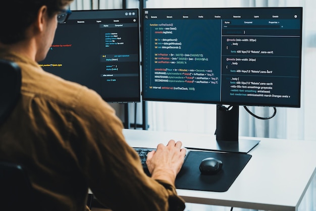 It developer working online software development coding on pc screens gusher