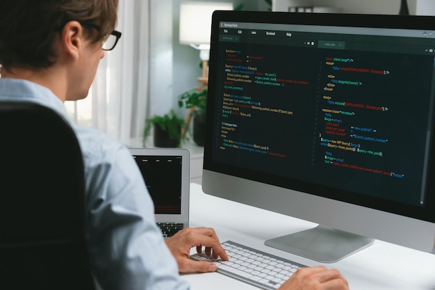it developer working online software development on pc and laptop pecuniary