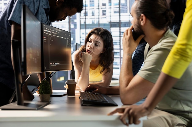 IT staff members gathered together to conduct code review