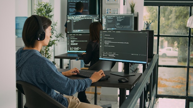 Junior developer programming code on terminal window, typing server information on computer. Programer coding database source with html script, developing algorithm and firewall security.