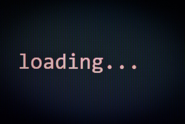 Loading message on display screen black background data progress loading complete alert computer network system software concept