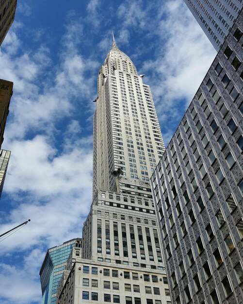 low angle view of chrysler building against cloudy sky
