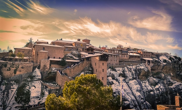 low angle view of houses on snowcapped mountain against sky