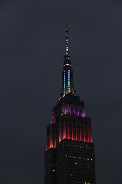 low angle view of illuminated building against sky at night