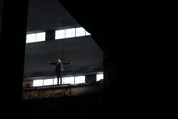 low angle view of man standing in abandoned building
