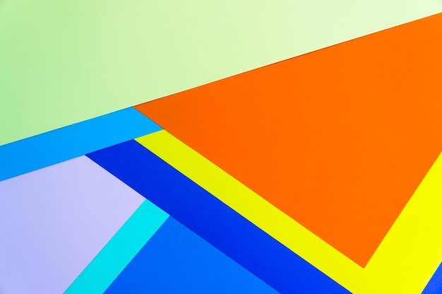 Low angle view of multi colored umbrella against blue sky