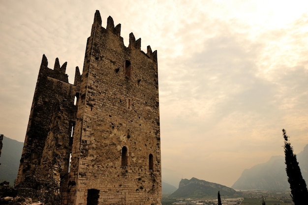 low angle view of old ruins against sky during sunset