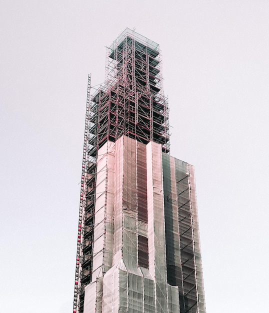 Low angle view of under construction building against clear sky