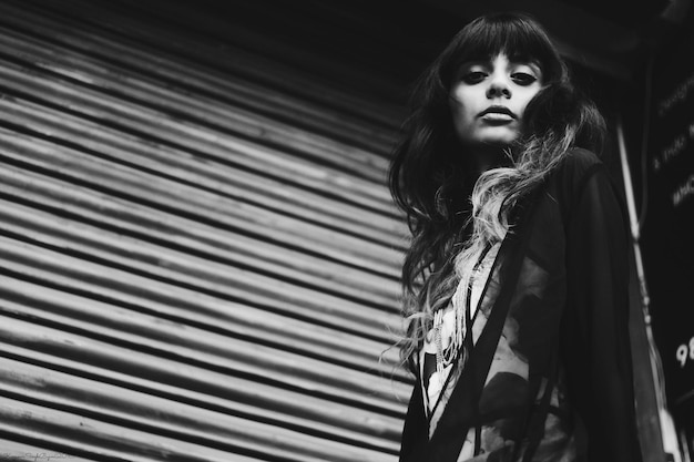 low angle view portrait of sad young woman