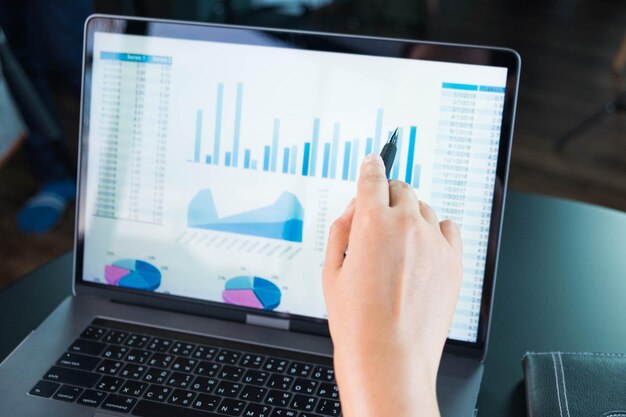 Low section of person using laptop on table
