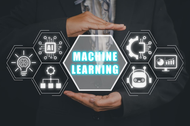 Machine learning concept Businessman hand holding machine learning icon on virtual screen