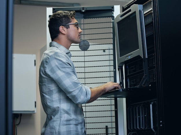 Man computer and server room with hardware for security firewall and safety from cyber attack Cybersecurity specialist tech and data center with software for digital forensic analysis or coding