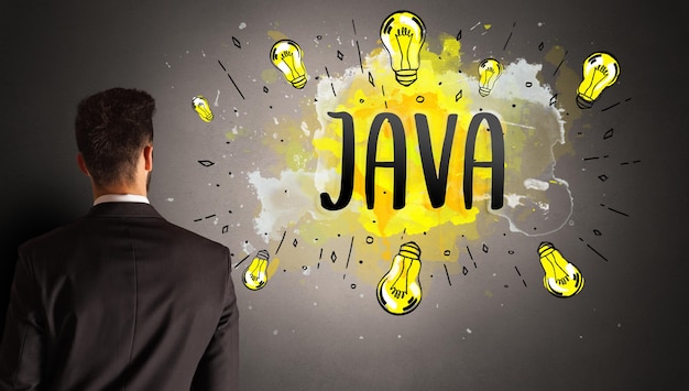 man drawing colorful light bulb