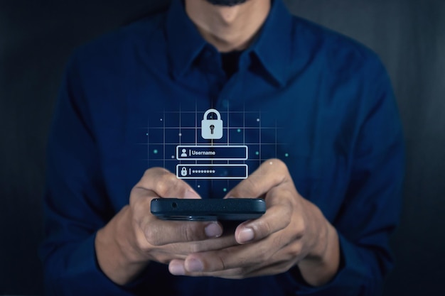 man holding a smartphone to login username and password on screen