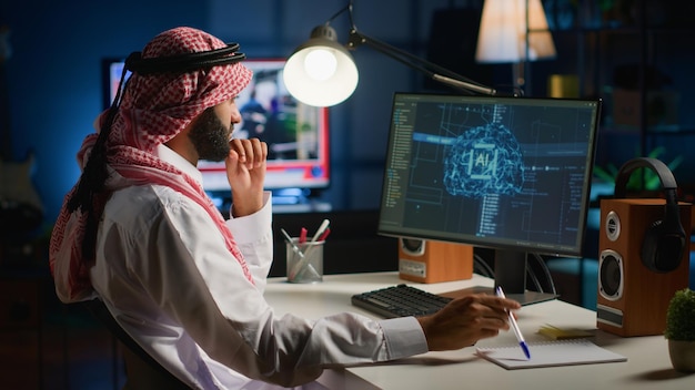 Man in office writing complex code