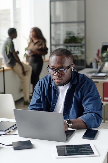 Man Listening to Music while Working