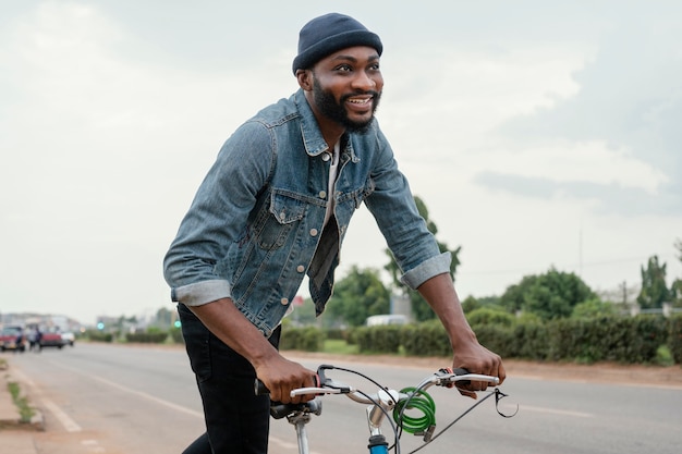 man traveling by bicycle medium shot