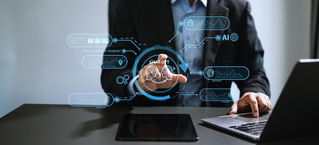 Man using chatbot in computer and tablet smart intelligence AiChat GPT Chat with AI Artificial Intelligence developed by OpenAI generate Futuristic technology robot in online systemxA