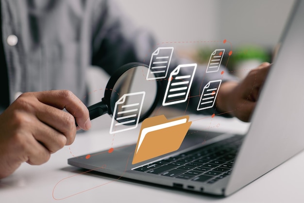 man with magnifying glass business documents scanning electronic online doc data analytics annual report result checking
