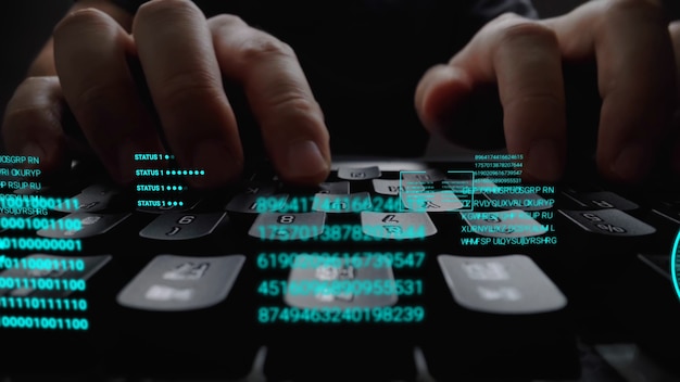 man working on laptop computer keyboard with graphic user interface gui hologram