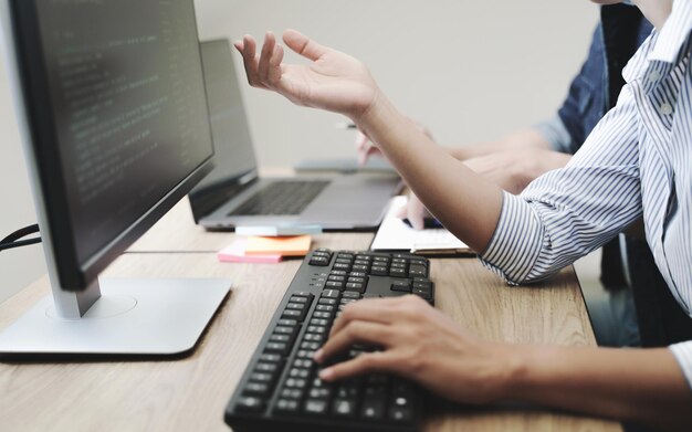 Midsection of colleagues working in office
