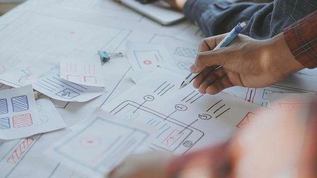 Midsection of design professionals brainstorming in office