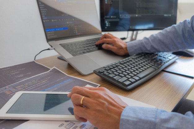 midsection of man using laptop on table