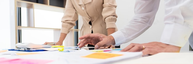 Midsection of people working on table