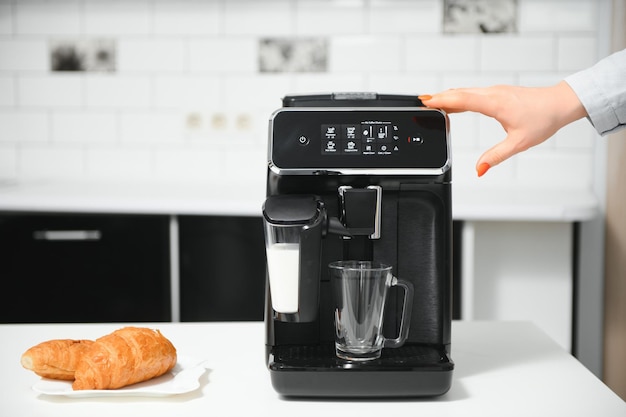 Modern coffee machine in kitchen