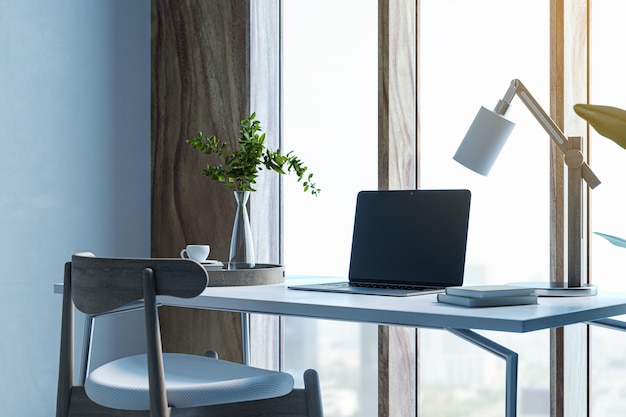 Modern designer desktop with mock up laptop various objects and window with city view in the background 3D Rendering