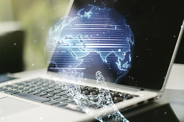 Multi exposure of abstract creative digital world map on modern laptop background tourism and traveling concept