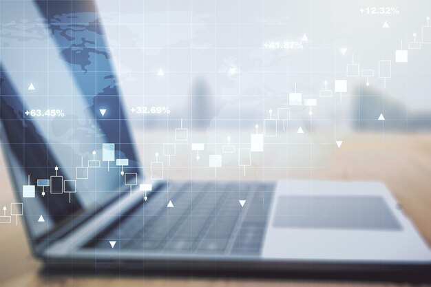 multi exposure of abstract creative financial graph with world map on modern laptop background, forex and investment concept