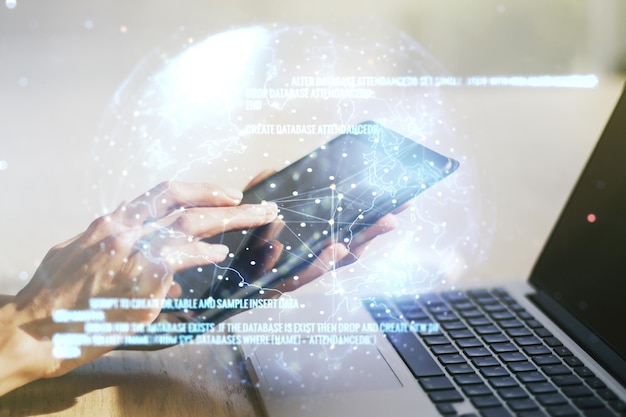 Multi exposure of abstract programming language hologram with world map and hand working with a digital tablet on background artificial intelligence and neural networks concept