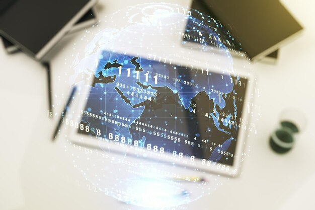 Multi exposure of abstract software development hologram with world map and digital tablet on background top view global research and analytics concept