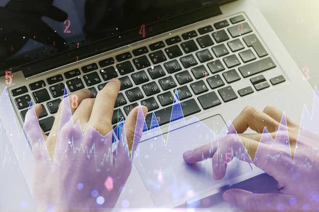 Multi exposure of abstract statistics data hologram interface with hands typing on computer keyboard on background computing and analytics concept