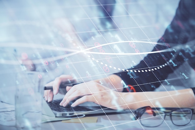 Multi exposure of woman hands typing on computer and financial graph hologram drawing Stock market analysis concept