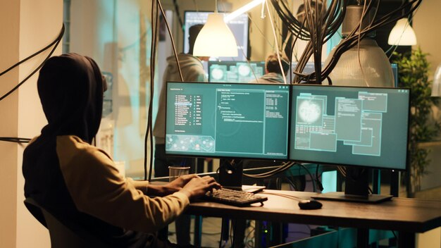 mysterious hacker breaking into pc system with trojan virus, gaining unauthorized network access. male spy doing phishing to steal passwords and important data, cyberbullying. handheld shot.