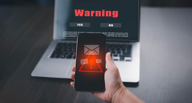 notification error and maintenance with triangle caution warning sign for notification error Programmer using laptop with triangle caution warning sign hacker attacks cyber crime cyber security