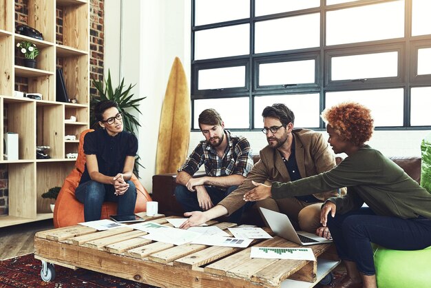 office paperwork and business people on sofa for discussion planning and feedback for startup progress creative agency employees and collaboration in meeting teamwork and cooperation for goal