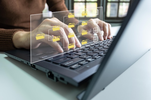 Officer using laptop manage files Document Management System DMS