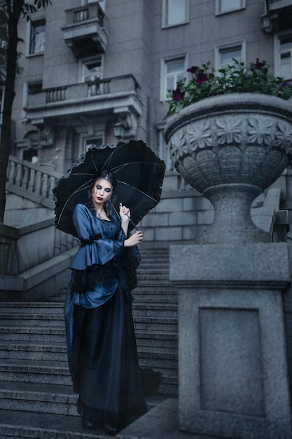 outdoors portrait of a victorian lady in blue