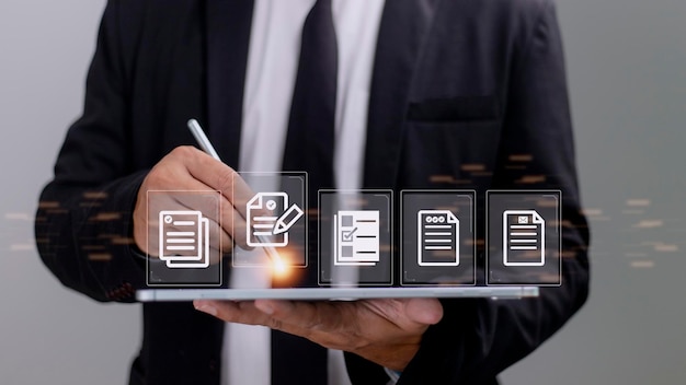 paperless workplace ideas esigning electronic signature document management a businessman signs an electronic document on a digital document on a virtual screen