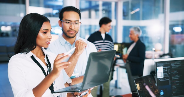 People meeting and developer on laptop in office of programming coding training and check server Team manager and helping for app testing IT intern and web application and troubleshooting system