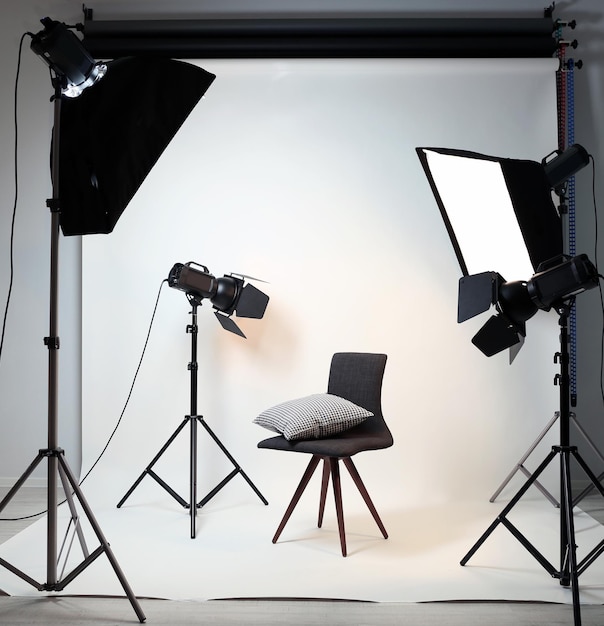 Photo studio with modern interior and lighting equipment