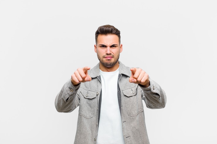 Photo pointing forward with both fingers and angry expression, telling you to do your duty