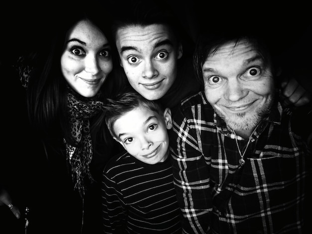 portrait of family against black background
